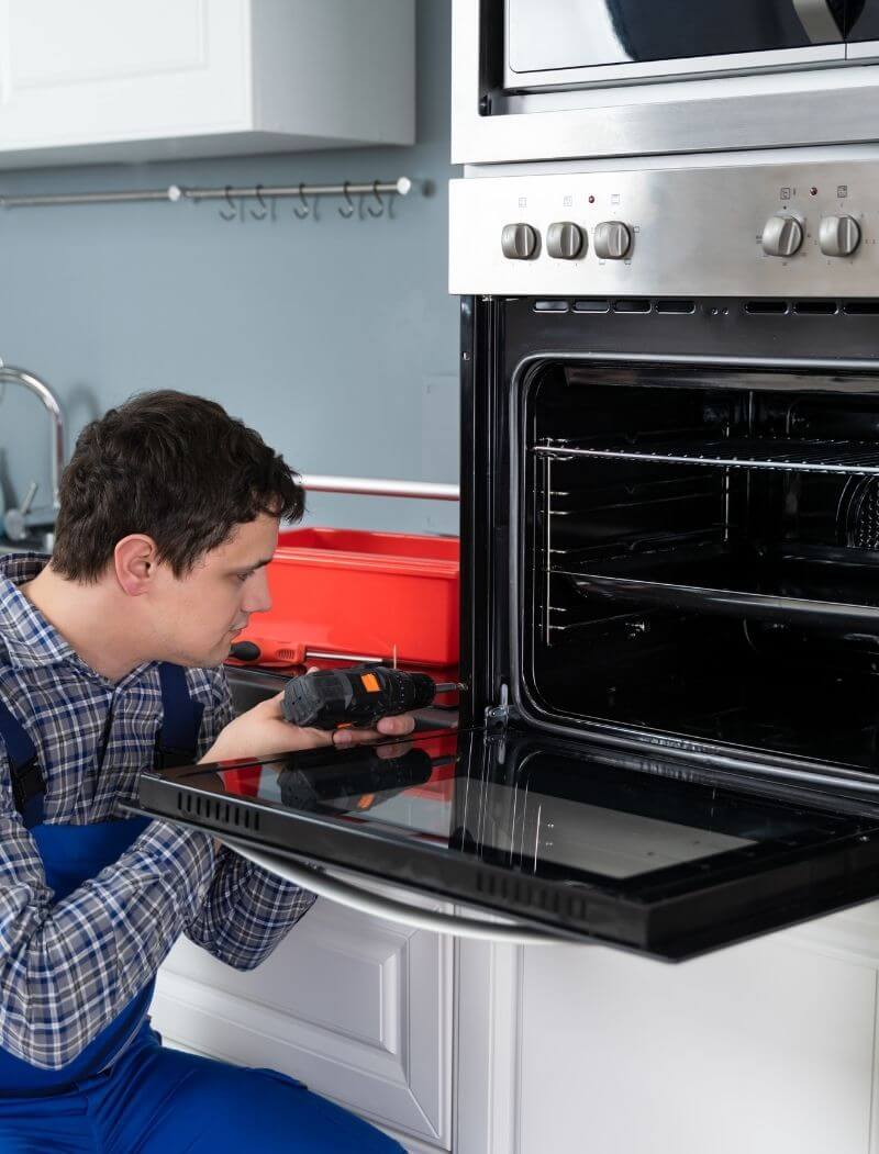 guy drilling in an oven