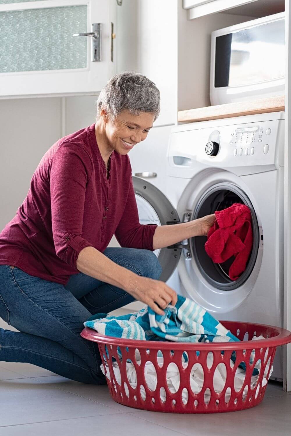 woman in red doing laundry