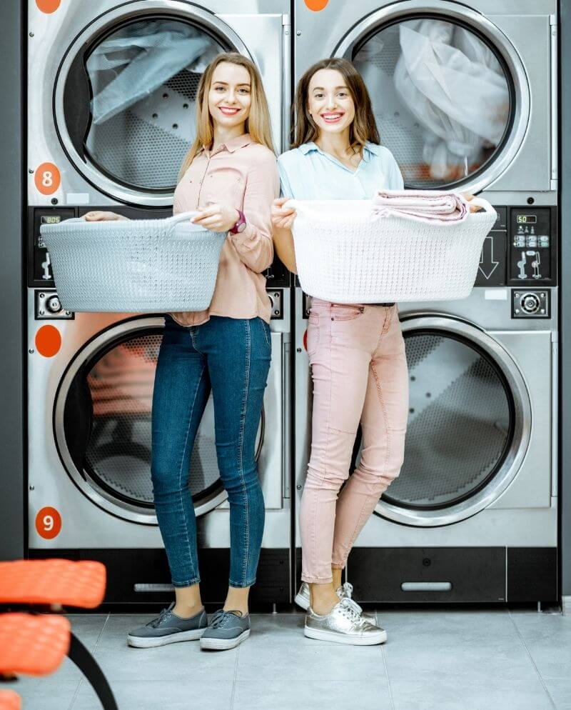 two ladies using commercial dryer